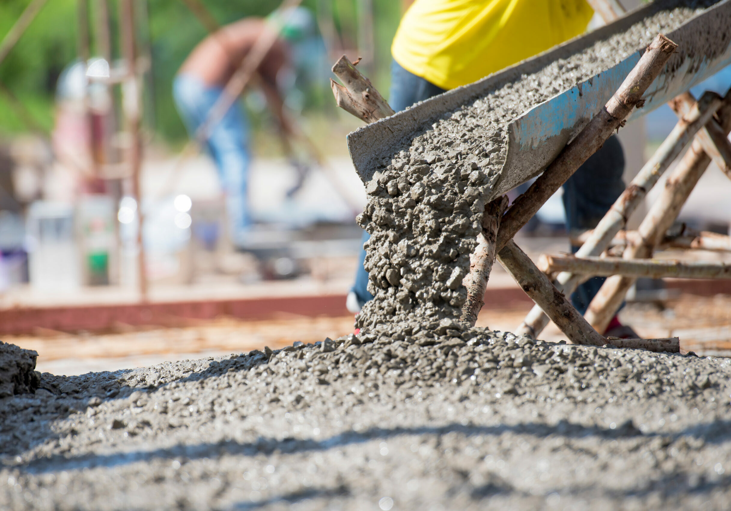 Concrete pouring during commercial concreting floors of building